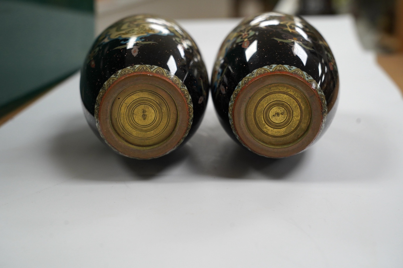 A pair of Japanese cloisonné enamel vases, signed, 14.5cm high. Condition - fair to good